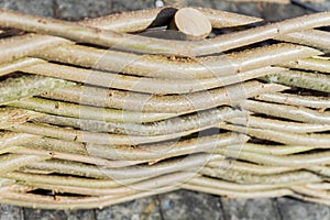 Wattle fence made of natural branches, garden decoration