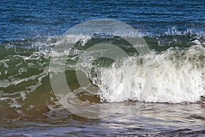 A wave on the beach in the Atlantic Ocean in Rehoboth Beach Delaware.