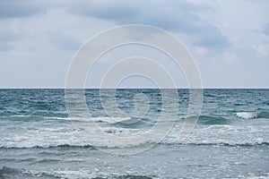 Wave on the beach, sea foam in the sea