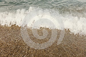 Wave of blue ocean on beach close up Summer Background