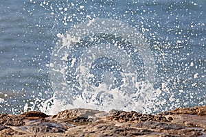 Wave of blue ocean on sandy beach. Background.