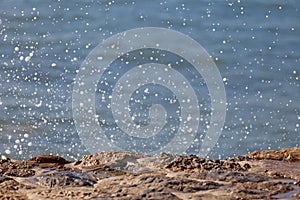 Wave of blue ocean on sandy beach. Background.