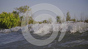 A wave from a boat on the river