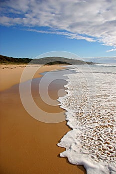 Wave breaking on a beach