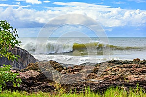 Wave breaking behind the rocks