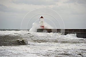 Wave breaking over lighthouse, Berwick upon Tweed