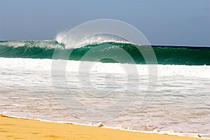 Wave breaking on sandy beach