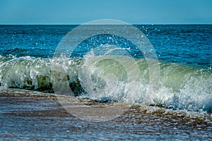 Wave breaking on a sandy shoreline