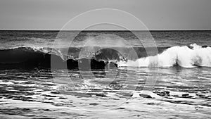 A wave breaking on the shore.