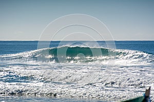 A wave breaks empty during mullet season at Campeche beach in Florianopolis Brazil