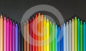 Wave of colorful magic maker on black background