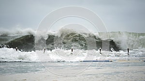 Wave crashing against beach pool