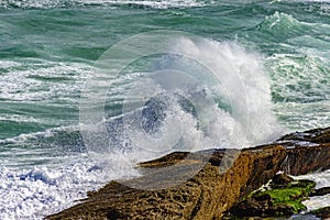 Wave crashing against rocks