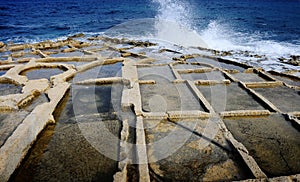 Wave crashing against saltpans