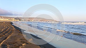 Wave crashing Caspian sea beach in Baku