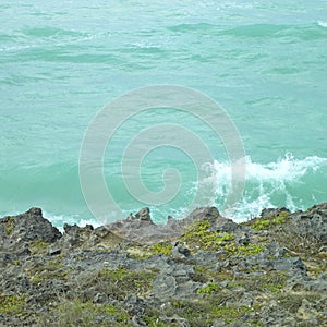 Wave crashing on a cliff