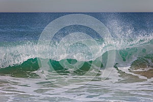 Wave crashing in Hermosa Beach, California
