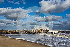 Wave Crashing on Jetty in Ocean