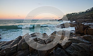 Wave crashing over rocks