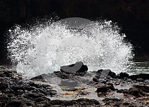 Wave crashing on rocks