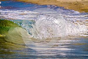 Wave crashing on the shore