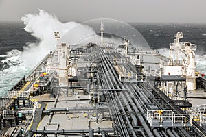Wave crushed against the ships bow
