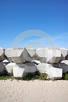 Wave dissipating concrete blocks on a beach