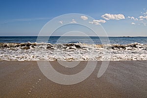 A wave flowed onto the beach at Kennington beach