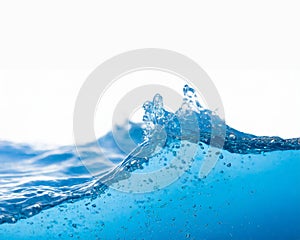 Wave of fluid blue water liquid with splashes isolated on white