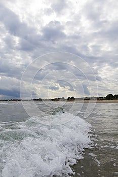 Wave form Ionian sea hitting the shore of Catania beach