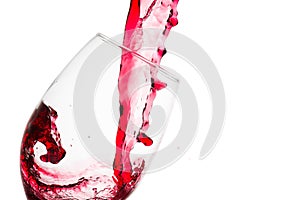 Wave formed on the pouring of red wine on a tasting glass