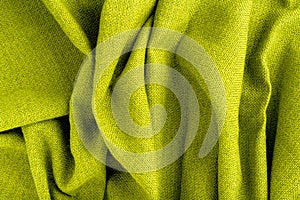Wave green natural linen fabric textile material texture as a background. green textile pattern for design in fashion as abstract