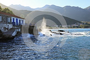 Wave hit the rocks near to the greek village Kiparissi Lakonia, Peloponnese during summer holidays.