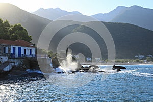 Wave hit the rocks near to the greek village Kiparissi Lakonia, Peloponnese during summer holidays.