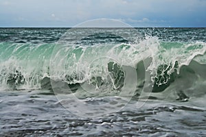 A wave hitting the coast