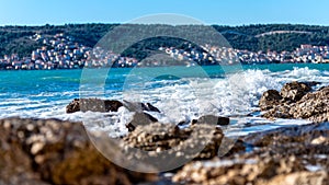 Wave hitting rocky shore...