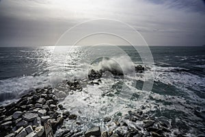Wave hitting a waterblock in Italy - Riomaggiore