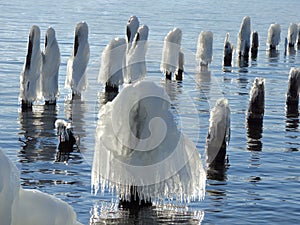 Wave ice covering old pier in Fingerlakes