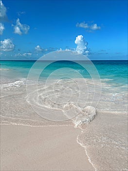 Wave making a shape of a heart on the sand