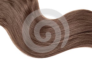 Wave of natural brown chocolate hair on white background