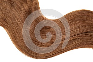 Wave of natural brown dark hair on white background