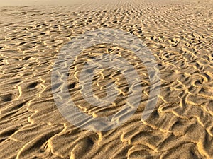 Wave patterns on the beach sand