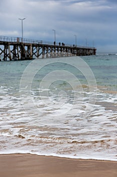 A wave on the Port Noarlunga beach with the selective blut of th