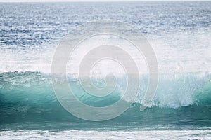 Big swell wave with white foam high energy impact perfect for surf and body board activity - danger with the ocean water -