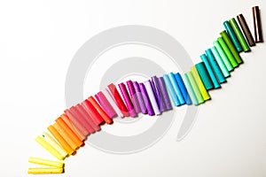 Wave of rainbow coloured pen lids