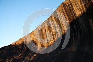 Wave Rock in Western Australia at sunset with clear sky