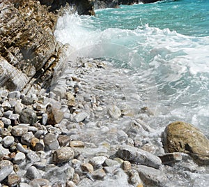 The wave in rocky beach