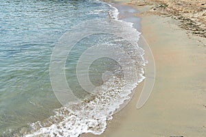 Wave on the sand beach.