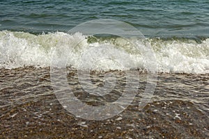 Wave on the sand beach.