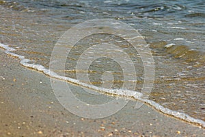 Wave on the sand beach.